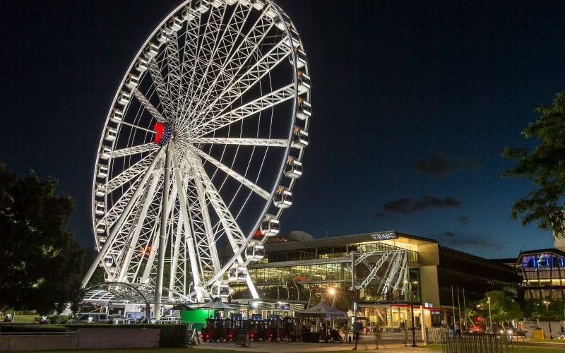 The iconic Wheel at night is a beautiful, glowing sight on the Brisbane skyline.